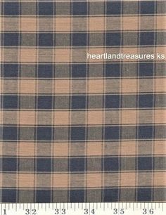 a brown and black plaid fabric with the words heartlanddreasuress on it