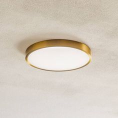 a round light fixture mounted on the ceiling