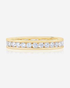 a yellow gold wedding band with diamonds