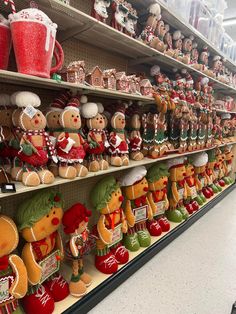 a store filled with lots of gingerbreads and other christmas decorations on shelves next to each other