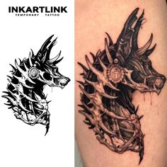 the tattoo design is done in black and white, with an image of a wolf's head on it