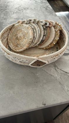 a bowl filled with lots of different types of food on top of a countertop