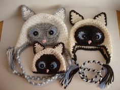 three crocheted hats with cats on them