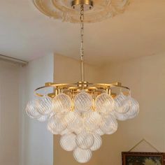 a chandelier hanging from the ceiling in a room