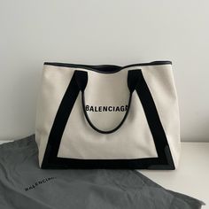 Balenciaga Medium Navy Cabas Canvas Tote Bag. Have Used A Few Times. Show Signs Of Wear. Please See Attached Pictures. In Good Condition. Width: 17” Height: 13” Depth: 8” Designer Canvas Bag With Top Handle For Errands, Designer Canvas Bag For Daily Use, Designer Canvas Shoulder Bag For Shopping, Designer Canvas Bag With Double Handle For Errands, Designer Double Handle Canvas Bag For Errands, Designer Canvas Shopping Bag With Handles, Designer Canvas Shoulder Bag, Designer Canvas Bag With Removable Pouch For Shopping, Luxury Large Capacity Canvas Bag For Errands