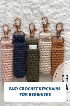 Five crochet keychains in various colors on a textured background, with text at the bottom: "Easy Crochet Keychains for Beginners". Crochet Project Videos, Macrame Crochet Keychain, Lip Balm Cozy Free Pattern, Crochet A Lanyard, Things To Make From Crochet, Key Fob Crochet Free Pattern, Beginner Crochet Plant Hanger, Crochet Quarter Keeper, Crotecht Patterns