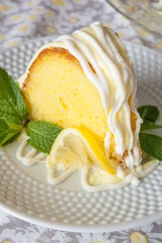 a lemon bundt cake on a plate with the words easy moist lemon bundt cake