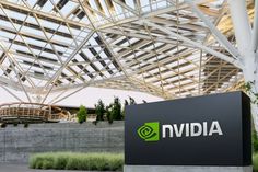 the sign for nvidia in front of a building with a large metal roof