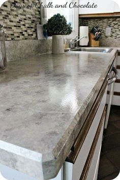 a counter top in a kitchen next to a sink