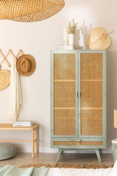 a wicker cabinet in the corner of a room