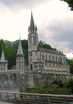 an old castle with two towers and a clock tower