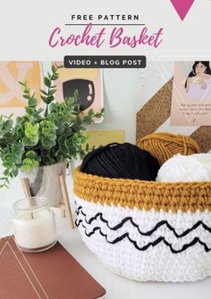 a crochet basket sitting on top of a table next to a potted plant