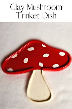 clay mushroom trinket dish with white dots on it and text overlay that reads clay mushroom trinket dish