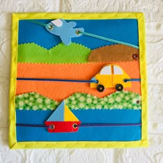 this is an image of a paper craft with cars and boats in the water on it