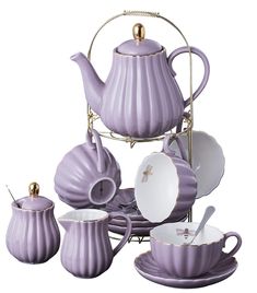 a purple tea set with matching cups and saucers