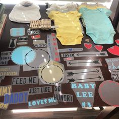 baby items are displayed on a table in a display case