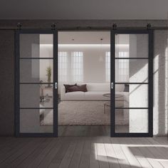 an open glass door leading to a living room