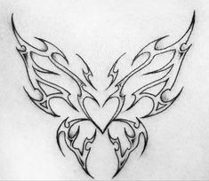 a tattoo design on the back of a woman's shoulder, with an intricate heart and wings