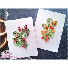 two greeting cards with quilled flowers on them next to an orange and grapefruit