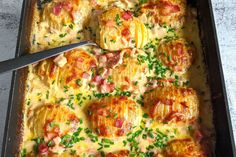 a casserole dish with ham and cheese on it, ready to be eaten