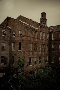 an old brick building with a clock tower