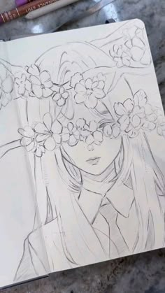 a drawing of a girl with flowers in her hair