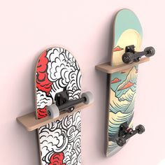 two skateboards mounted to the side of a wall with designs on them and one is upside down