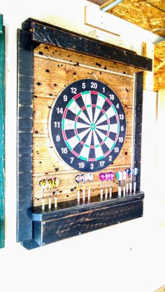 a dart board mounted to the side of a wall