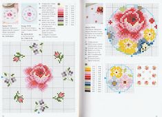 an open book with cross - stitch designs and instructions on the pages, including flowers