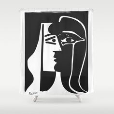 a black and white shower curtain with an egyptian woman's face