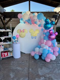 balloons and mickey mouse ears are on display