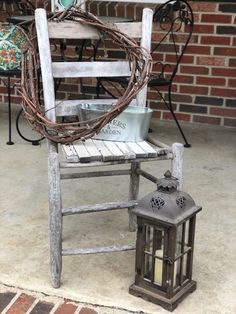 an old chair with a candle on it