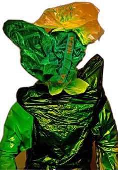 a plastic bag that has been wrapped in green and yellow foil to look like a frog