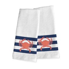 two white towels with crab on them, one is blue and the other is red