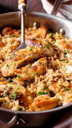 chicken and rice in a skillet with a spatula