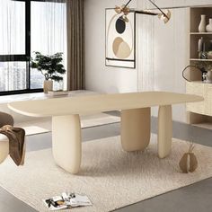 a modern dining room with an oval table and chairs