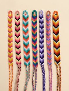 five different colored braided lanyards are lined up