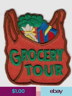 the grocery tour logo is shown on a red bag with green and blue items in it