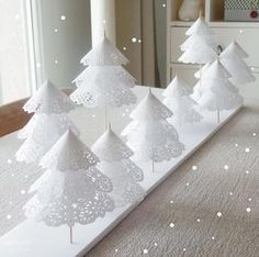 paper doily christmas trees are on display in the store's facebook page, and then they appear to be cut out