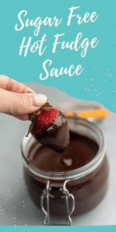 a hand dipping a strawberry into chocolate sauce with the words sugar free hot fudge sauce