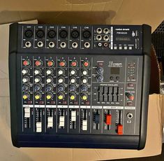 a sound board sitting on top of a cardboard box