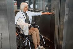 Stock Image: Mature woman in glasses on disabled carriage using elevator Woman In Glasses, Unisex Bathroom Sign, Lactation Room, Bus Stop Sign, Record Room, Out Of Service, Lobby Sign, Library Signs, The Americans