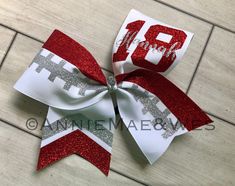 "Size: 1 Large 7\" x 7\" cheer bow made from 3 inch grosgrain ribbon. Custom Requests: To request an alternate ribbon color, plain finish (rather than glitter) or font change please message me for a custom listing. Colors: White ribbon is used as a default. Shown in white ribbon, red glitter and silver glitter Unless otherwise requested the thicker stripe, number and large bottom chevron will the same color. Football Stitches glitter stripe, name letters and top small chevron will be the same co Flag Diy, Christmas Things To Do, Cute Cheer Pictures, Fabric Stiffener, Football Cheer, Cheer Stuff, Diy Sneakers, Bow Ideas, Cheer Hair