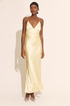 Ethereal elegance. The golden hue and diamante-encrusted straps are inspired by the ebullient romance of a sunset in Capri. An ode to love ever-after, this gown is imbued with whimsy and sultry sophistication

SIZING: True to size. AU: Model wears a size 8 / US: Model wears a size 4.

FABRICATION: Main: 100% Viscose. Lining: 100% Polyester.

- Diamante-encrusted straps
- Triangle neckline
- Deep V back Luxury Fitted Slip Dress For Wedding, Chic Gold Gown For Gala, Gold Evening Dress For Formal Summer Events, Gold Silk Evening Dress For Prom, Gold Silk Prom Evening Dress, Gold Summer Evening Dress For Gala, Champagne Elegant Evening Slip Dress, Elegant Champagne Slip Dress For Evening, Glamorous Gold Slip Dress For Formal Occasions