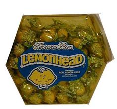 lemonhead candies in a plastic container on a white background with the word lemonhead