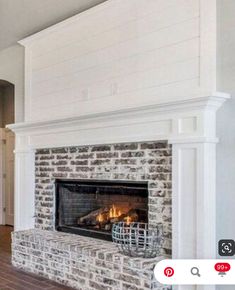 a living room with a fire place and hardwood floors