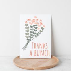 a card that says, thanks a bunch on it with flowers in pink and green