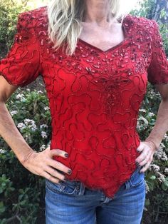 "Red Beaded top,Sequin Top, Formal Blouse, Large Gorgeous beaded and sequin top in excellent condition Measurements: Chest 36\" Length from top of collar to bottom 36\" Solid nice piece. Excellent condition: No missing beads. NK731F2 Red Beaded top,Sequin Top, Formal Blouse, Large" Festive Sequined V-neck Top, Festive V-neck Sequin Top, Stretch Beaded Top For Party, Red Sequin Evening Blouse, Glamorous Beaded Tops For Formal Occasions, Glamorous Fitted Beaded Tops, Red Sequined Blouse For Evening, Formal Beaded Tops For Summer, Embellished Short Sleeve Tops For Party Season