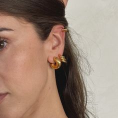 Designed in-house as the Joiana Perfect Chunky Hoops, your daily earwear. The earrings made for the daily hoop lovers, who want a small chunky hoop for daily wear. Material Stainless Steel 18 k gold plated (Gold Hoops) Joiana Ball Back Gold Plated Ear Cuff For Everyday Wear, Everyday Gold Plated Ear Cuff, Gold Tarnish-resistant Small Hoop Ear Cuff, Trendy Gold Huggie Ear Cuff, Tarnish Resistant Gold-plated Hoop Ear Cuff, Gold Plated Tarnish Resistant Hoop Ear Cuff, Gold Plated Hoop Ear Cuff Tarnish Resistant, Everyday Gold Ear Cuff With Ear Wire, Gold Small Hoop Hypoallergenic Ear Cuff