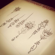 a sheet of paper with writing on it and flowers drawn on the top of it